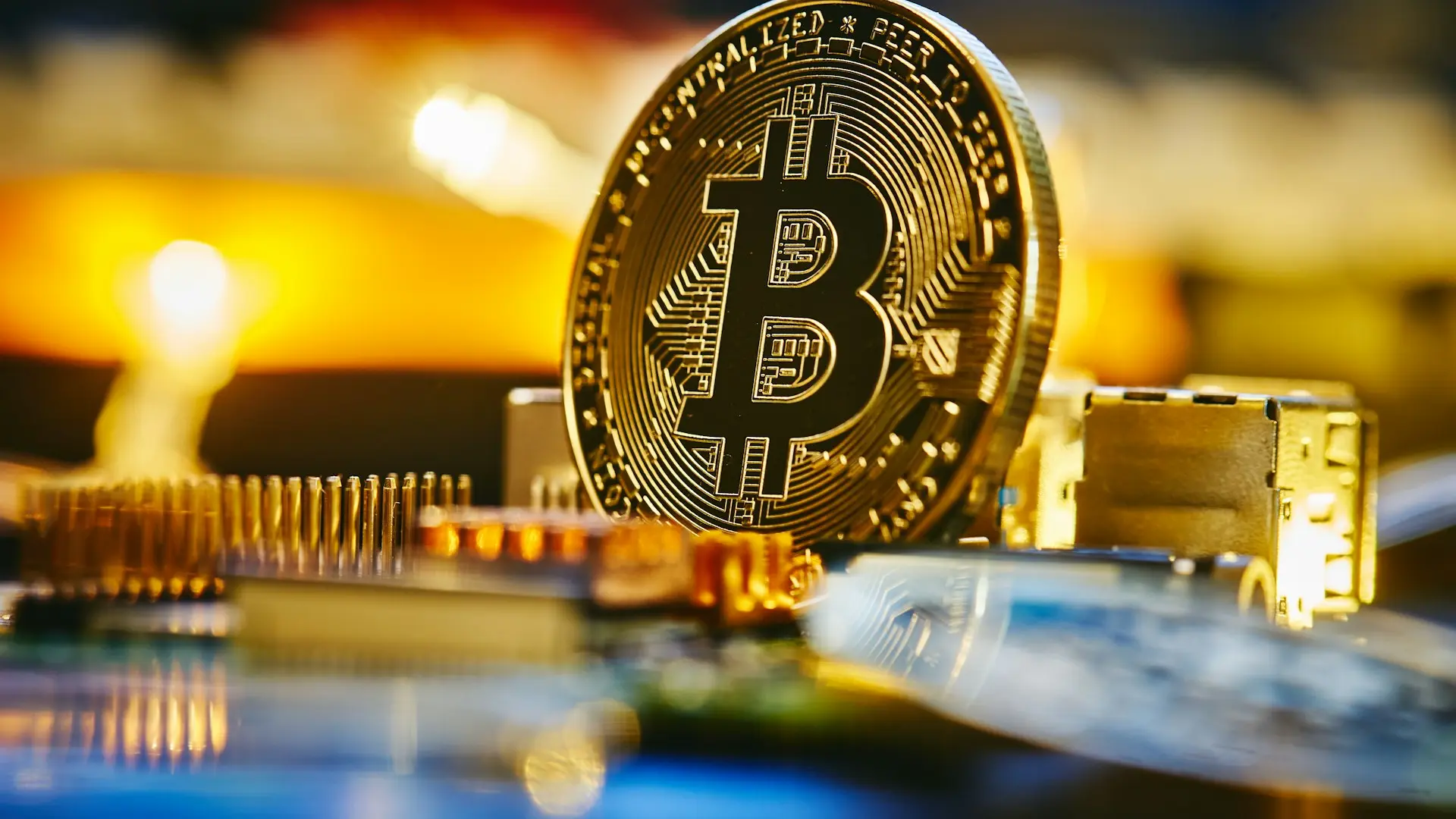 a bitcoin sitting on top of a computer chip